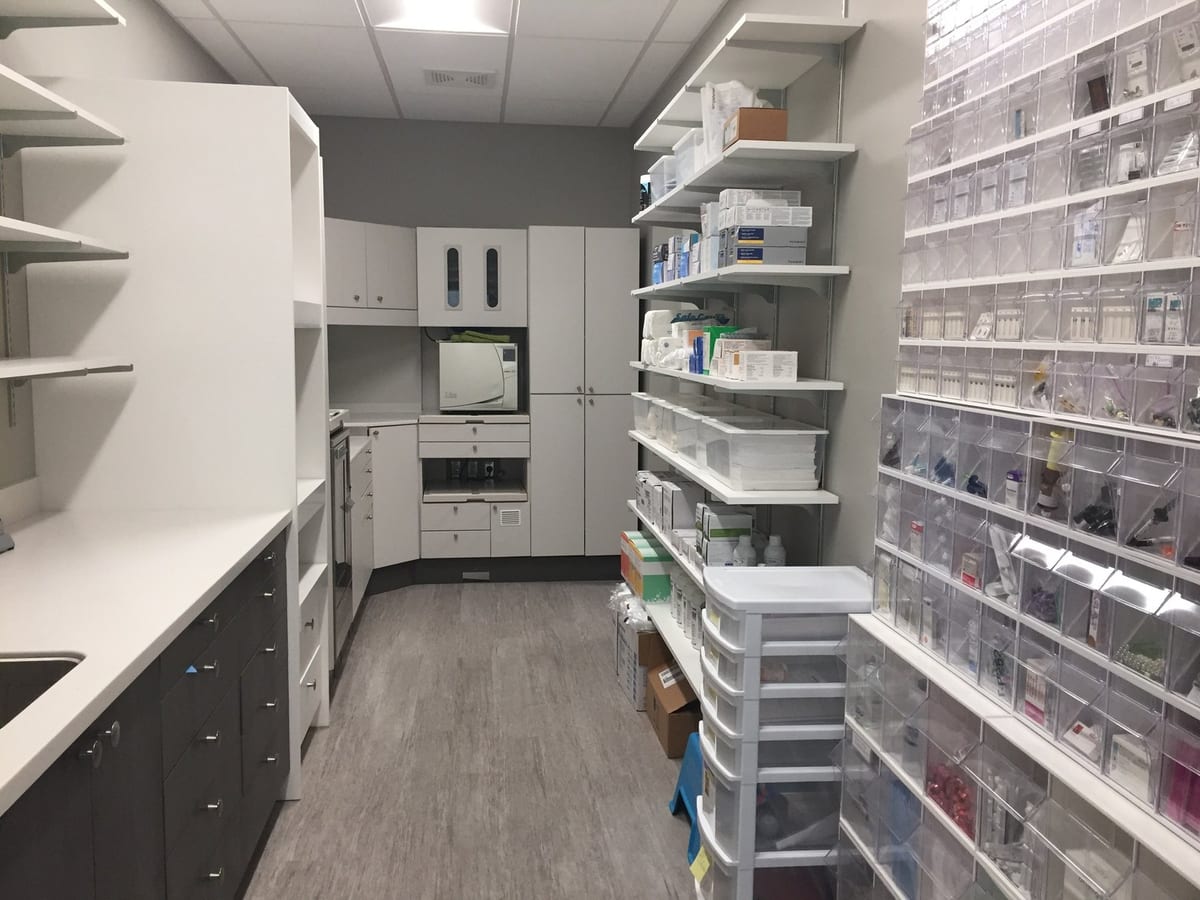 The instrument and supply room at Moose Lake Dental, with the sterilizer and the stocked shelving